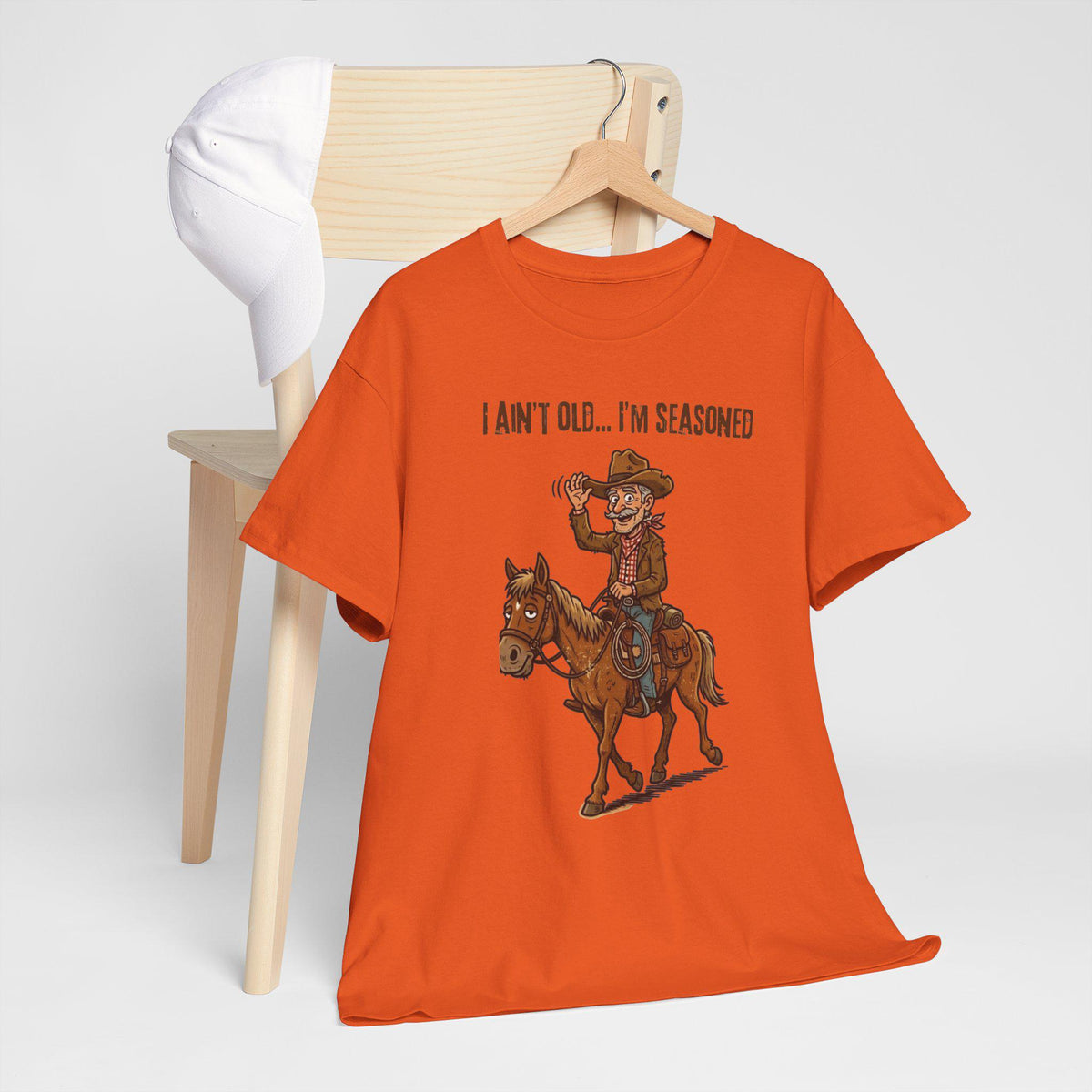 I Ain't Old I'm Seasoned Cowboy on Horse T-Shirt | Western Humor, Rodeo Graphic