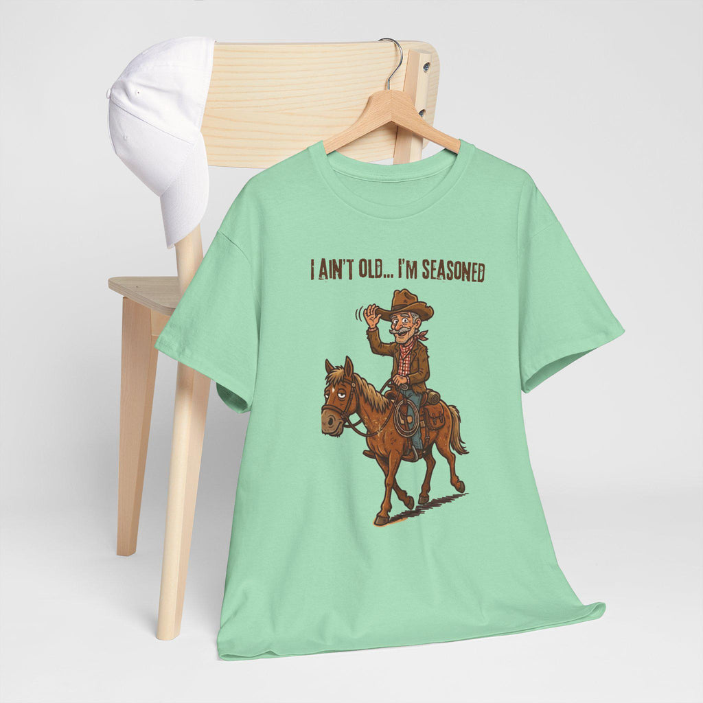 I Ain't Old I'm Seasoned Cowboy on Horse T-Shirt | Western Humor, Rodeo Graphic