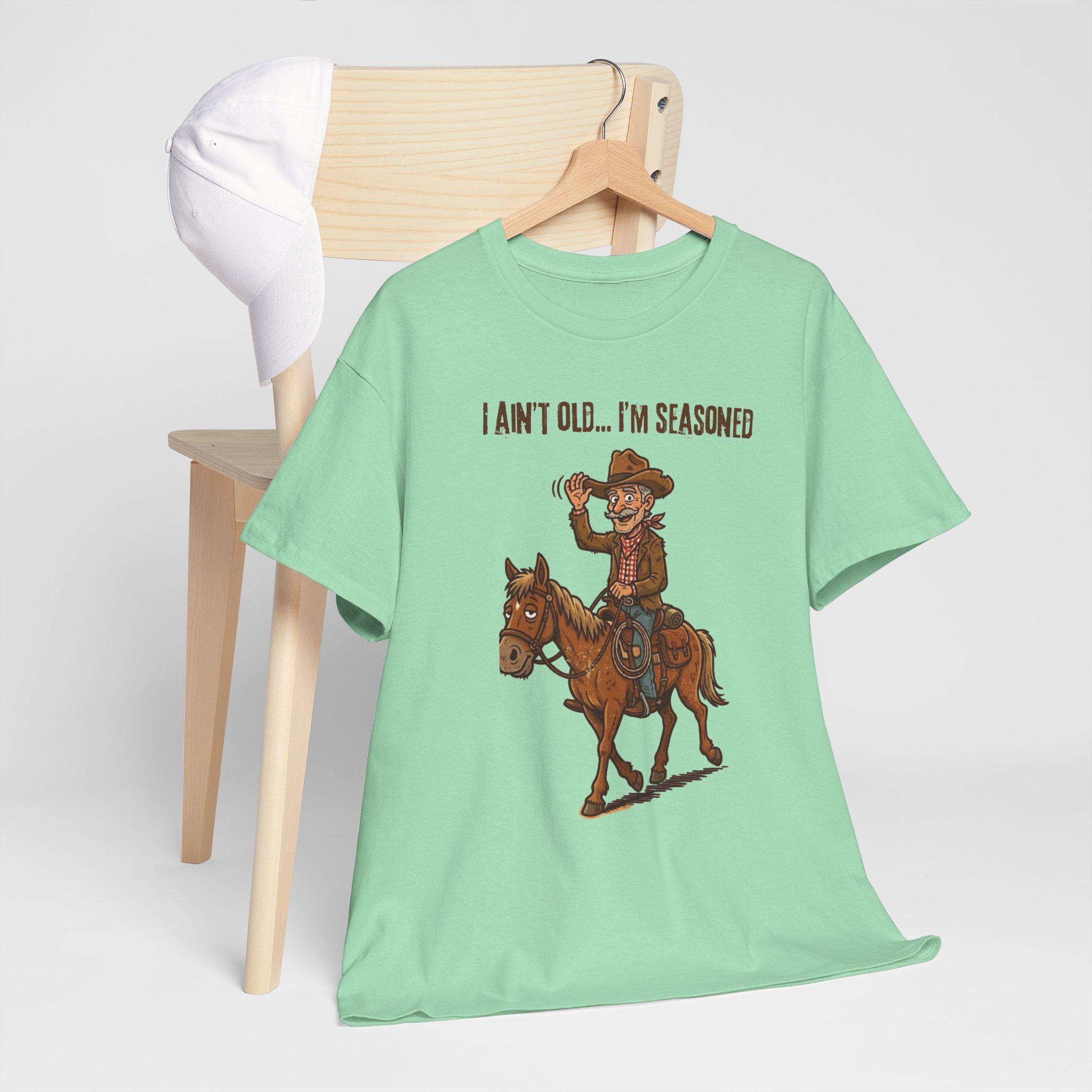 I Ain't Old I'm Seasoned Cowboy on Horse T-Shirt | Western Humor, Rodeo Graphic
